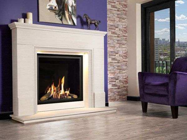 The Da Vinci mid-depth gas fire pictured in a limestone surround set against a beautiful deep black reflective enamel interior, creating a stunning contrast finish