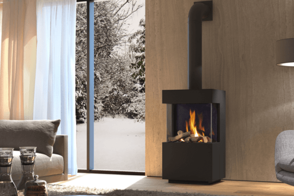 The DRU Polo is an attractive angular three-sided, freestanding gas fire. The black interior and decorative logs combine to provide the illusion of a natural fire. Both the exterior of the gas fire and its connecting materials are pictured in black.