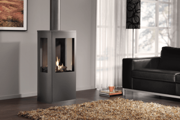A classy 3-sided gas stove the DRU Trio freestanding gas stove combines the nostalgia of a rustic stove with innovative technology. It is a freestanding, balanced flue model pictured here in archetypal anthracite finish with a striking, 3-sided log fire display producing a comforting radiance all around the living room.