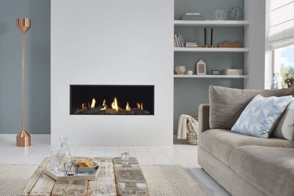 1 metre wide hole-in-the-wall gas fire in the popular letterbox shape, pictured here with a log fire beds and black mirrored Ceraglass interiors in a white feature wall