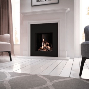 The Global 70XT is pictured here with a black glass interior, set into an elegant black insert and white marble surround. The flames are enclosed in authentic wood-effect ceramic logs. This causes the flames to gently lap around them, creating a completely realistic flame effect.