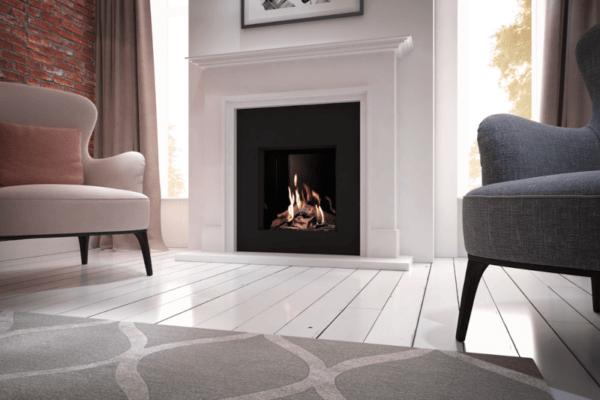 The Global 70XT is pictured here with a black glass interior, set into an elegant black insert and white marble surround. The flames are enclosed in authentic wood-effect ceramic logs. This causes the flames to gently lap around them, creating a completely realistic flame effect.
