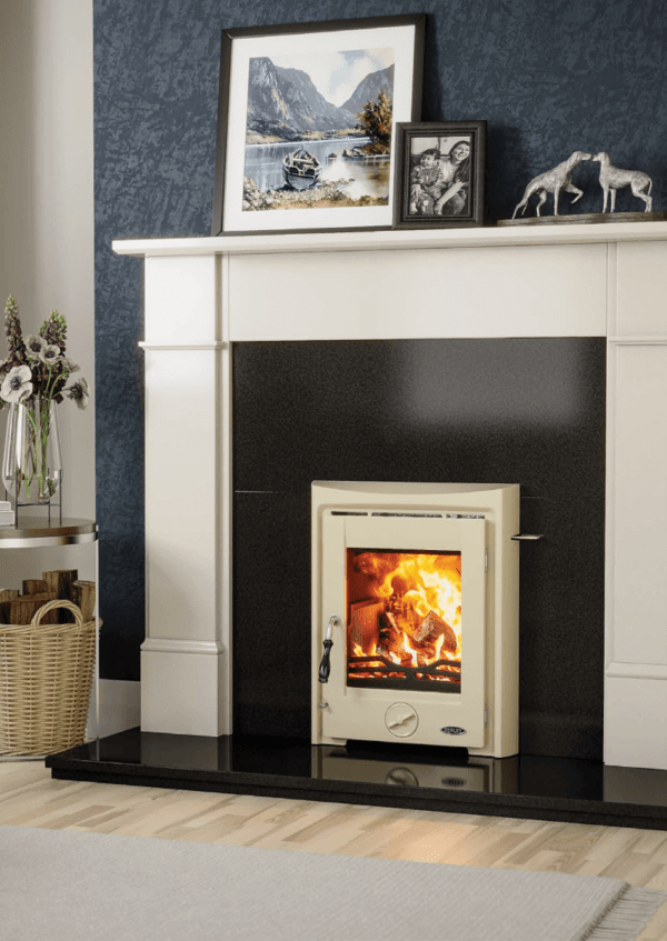 The Apollo is a fully cast iron multi fuel stove. Pictured here in stunning cream enamel set into a black granite insert and white marble surround with a black granite hearth.
