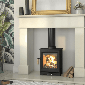 The Leaf is a Steel body stove with cast iron door, pictured here in simple black set within a limestone hearth, chamber and surround