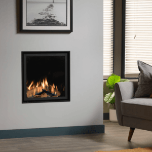 This glass fronted Ravel is shown here installed as a Hole in the Wall fire with the sleek black Edge trim, with black interior for the trimless look.