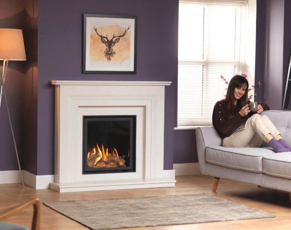 The Ravel 600 is a stunning glass fronted fire. Shown here in the Amalfi 600 micro marble surround in white, and installed with the sleek black Edge trim, for the trimless look. The Ravel 600 will fit nearly all masonry fireplace openings.