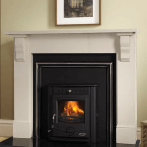 The Achill multi-fuel Insert boiler in black, inset into a black granite insert with silver trim and white stone fireplace surround