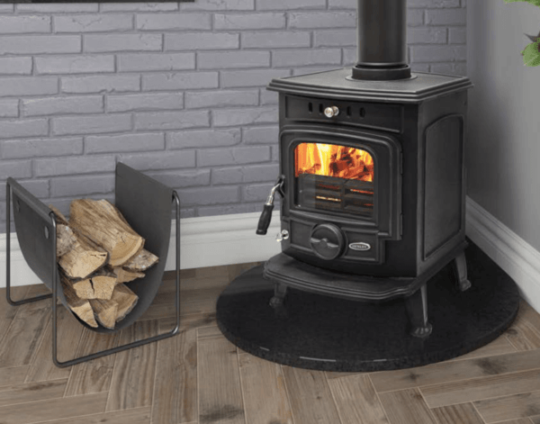 The Aran 6kW multi fuel stove from Elegant Fires has a beautiful traditional design that will complement any interior setting. Completely manufactured in cast iron, it is pictured here in black enamel with a chrome and black handle and matching black pipework. It is set upon a black circular granite hearth.