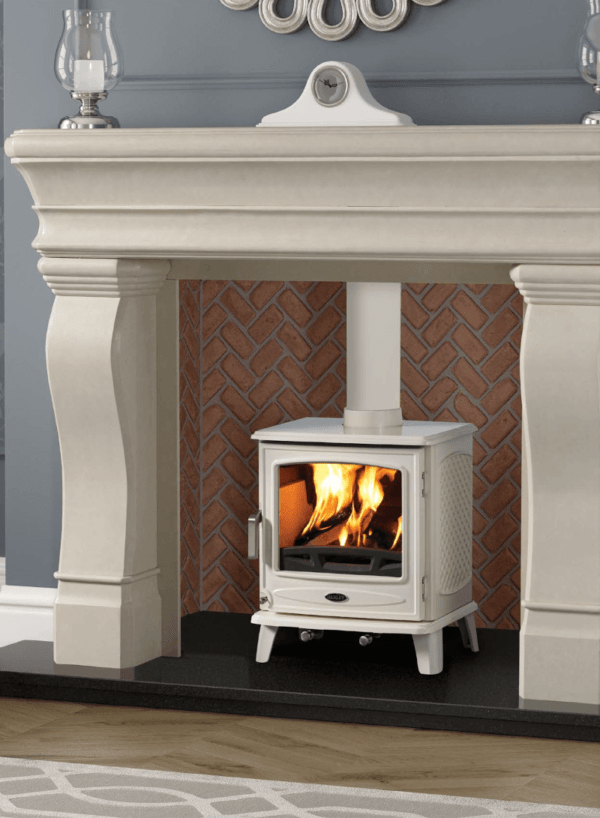 Stunning cream enamel stove set against a redbrick herringbone chamber and stone surround