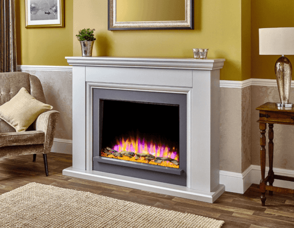 A compact, contemporary fireplace, finished in textured white and pearlescent river. The Valdina displays intricate styling and detailing with a chunky shelf across the top. This suite comes with the Infinity E 480 4D Ecoflame electric fire from Elegant Fires